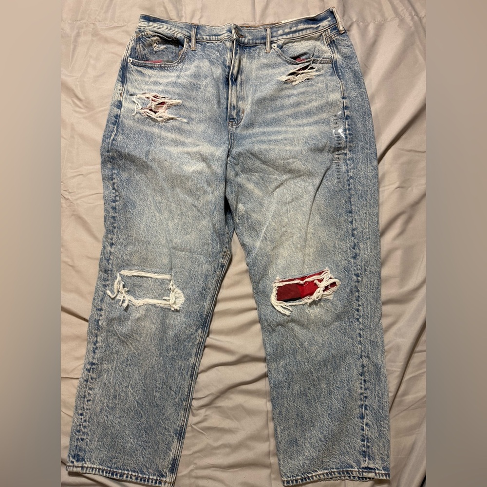 Distressed Blue Jeans with Red Accents